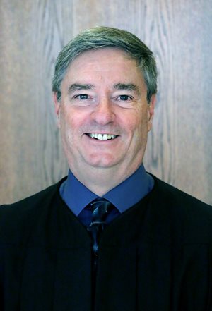 District Judge John Kisner Jr.
